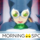 A new animted Catwoman in costume with her goggles eyes a green jewel on a laser-wire-surrounded pedestal.
